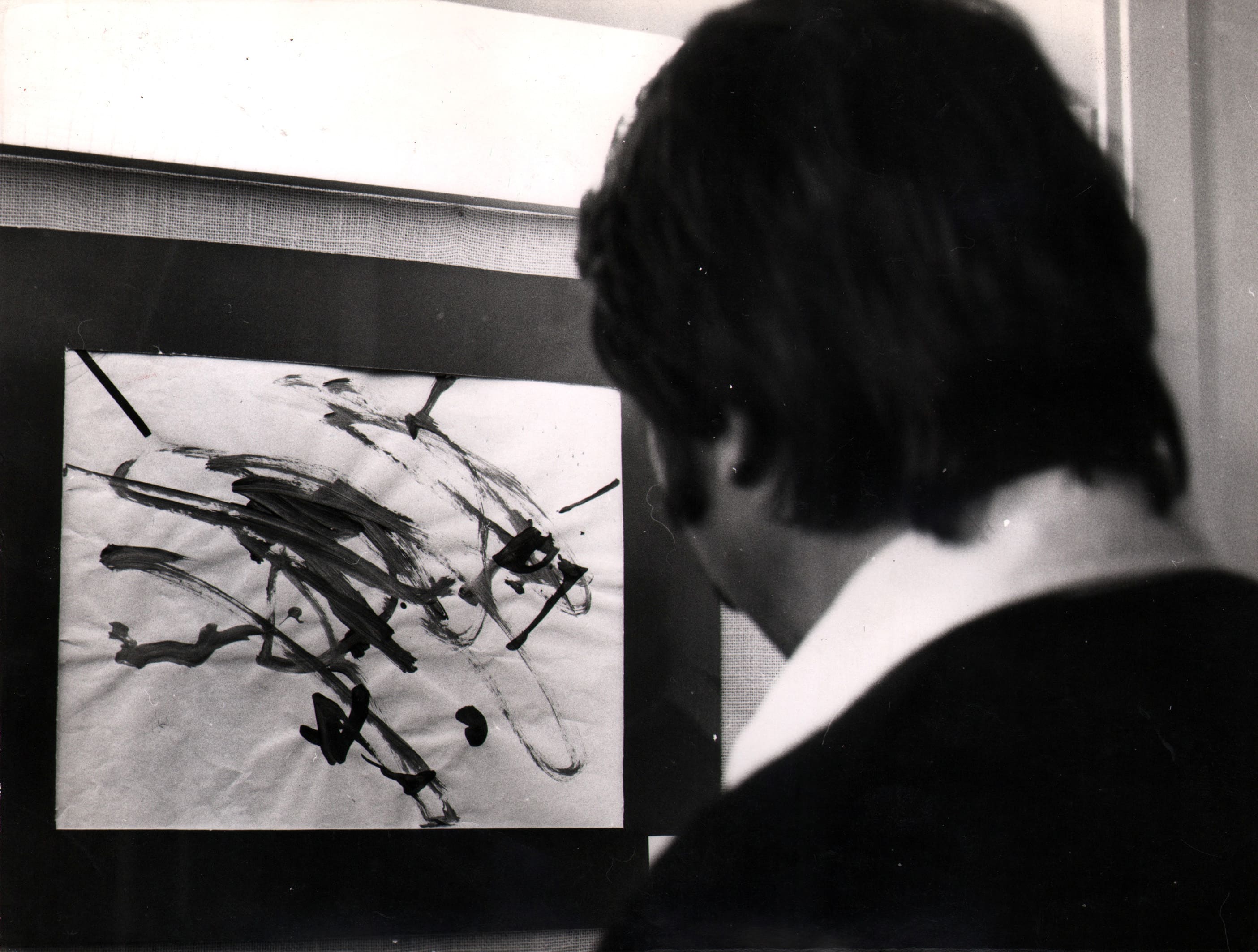 Chimpanzee artists - Man Looking at Painting Made By Chimpanzee, 1978